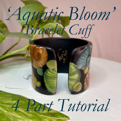 Join me on a 4 part YouTube tutorial journey on how I made the ‘Aquatic Bloom’ polymer clay bracelet cuff. I will show you my new cuff base technique; we will make a handmade stamp for the Mokume Gane bubbles; we will make our plants & creatures with the magic of Mica Shift, and lastly create a unique veneer, assemble and finish your one of a kind jewellery art. Parts 1 & 2 are now on YouTube 😃 Happy Days Polymer Inspiration, Polymer Clay Bracelet, Handmade Stamps, Mokume Gane, Clay Bracelet, Polymer Clay Tutorial, Clay Tutorials, Bracelet Cuff, Youtube Tutorials