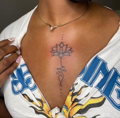 Tattoos In Between Breast Black Women, Cute Spine Tattoos For Black Women, Cute Shoulder Tattoos For Black Women, Afrocentric Tattoos For Women, Sternum Tattoo Black Women, Lettering Tattoos, Small Chest Tattoos, Letter Designs, Black Girls With Tattoos