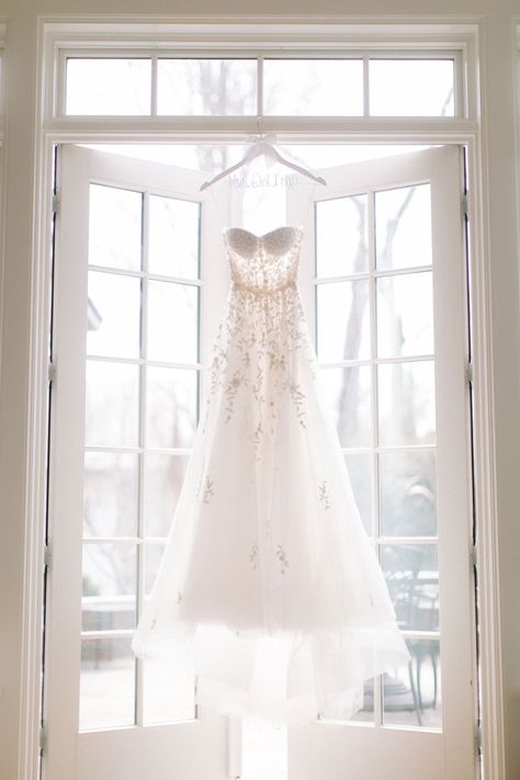 reem-acra-wedding-dress-strapless-personalized-hanger-hanging-in-window-french-doors-sunlight Hanging Wedding Dress, Wedding Dress Hanging, Wedding Photo List, Wedding Dress Photoshoot, Wedding Day Dresses, Wedding Dress Photography, Wedding Photography Checklist, Wedding Portrait Poses, White Weddings