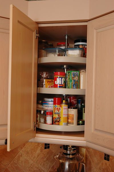 Remodeled kitchen with carousel cabinet storage by Neal's Design Remodel. Base Cabinet Storage, Kitchen Corner Cabinet, Corner Cabinet Organization, Functional Kitchen Design, Corner Storage Cabinet, Upper Kitchen Cabinets, Corner Kitchen Cabinet, Kitchen Corner, Kitchen Cabinet Organization