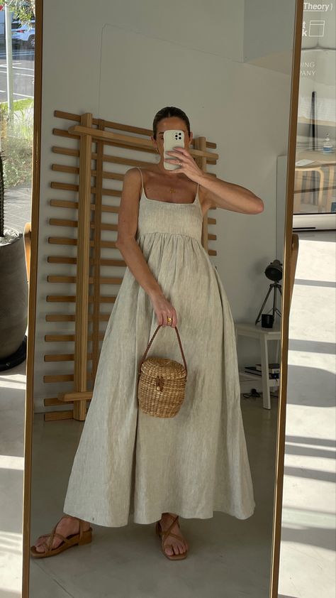 Women wearing full length linen dress. The dress is a neutral colour with thin straps, a fitted bust area and a flowy skirt 2025 Summer Fashion, Modern Bohemian Fashion, Style Inspiration Summer 2024, Spring Italy Outfits, Nantucket Outfit Summer, European Spring Outfits, Teacher Summer Outfits, Rainy Day Summer Outfits, Honeymoon Fits