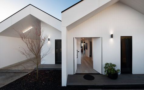 Scandi Modern Farmhouse Exterior, Modern Scandi Exterior, Scandi Bungalow, Scandi Barn House, Black Cladding White Render House, Tom Dixon Lighting, Langham Hotel, Beach House Furniture, Fireside Chairs