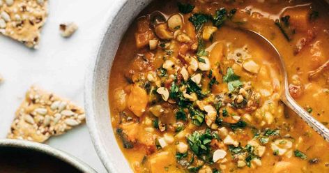 Spicy Peanut Soup with Sweet Potato + Kale Spicy Peanut Soup With Sweet Potato And Kale, Spicy Peanut Soup, Soup With Sweet Potato, African Peanut Soup, African Peanut Stew, Pinch Of Yum, Peanut Stew, Sweet Potato Kale, Peanut Soup