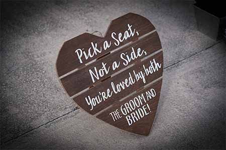 6 Ways to Make Folding Chairs More Elegant (From Ugly to Stylish) Rustic Ceremony, White Folding Chairs, Idaho Springs, Metal Folding Chairs, Ceremony Sign, Pick A Seat, Rustic Wedding Signs, Rocky Mountain Wedding, Ceremony Signs