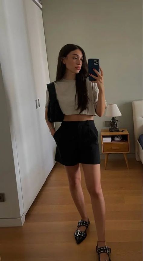 a minimal summer look with a crop tee, black cropped shorts, black studded flats and a black bag Black Sling Back Flats Outfit, Black Buckle Flats Outfit, Ganni Buckle Ballerina, Ganni Sandals Outfit, Buckle Ballet Flats Outfit, Ganni Ballerinas Outfit, Ganni Ballet Flats Outfit, Ganni Ballet Flats, Buckle Flats Outfit