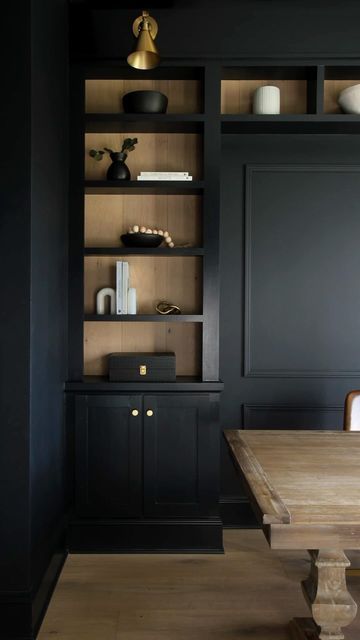 Kelly Jones on Instagram: "Want to enhance the look of a built-in? We added some leftover white oak hardwood flooring to the back of our moody office but-ins. This added contrast, texture and a great backdrop for the shelf decor. 🤗

#beforeafter #interiorismo #office #homeoffice #remodel #homesweethome #homedesign" Men’s Office Built Ins, Bookshelves Modern Design, Built In Shelves Office Bookshelves, Built In Shelves Study Room, Black Office Built Ins With Desk, Black Office Bookshelves, Office With Black Built Ins, Black Built Ins With Wood Shelves, Walnut Office Cabinets