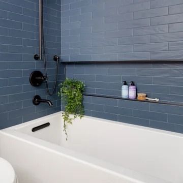 75 Alcove Bathtub with a Niche Ideas You'll Love - July, 2024 | Houzz Beach House Guest Bathroom, Tub Niche, Beach Style Bathroom, Blue Bathroom Tile, Modern Remodel, Bathtub Tile, Battery Park, Contemporary Light Fixtures, Bathroom Tile Designs