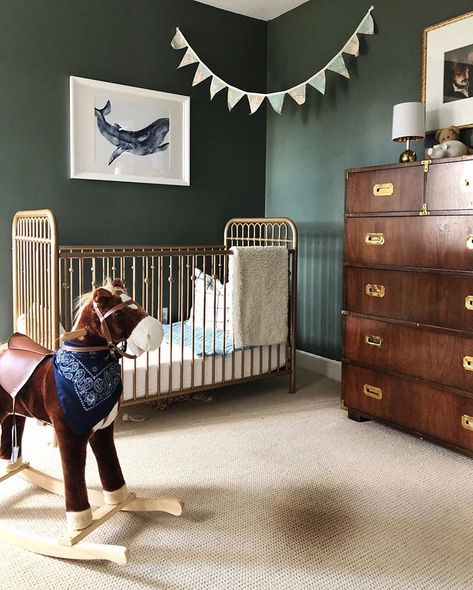 Green boy nursery with gold crib. Traditional baby boy nursery. Dark green baby boy nursery. #nurseryideas #boynursery #nurserydesign #boysroom #kidsrooms Gold Crib Boy Nursery, Sherwin Williams Paint Colors Green, Green Nursery Boy, Dark Nursery, Gold Crib, Nursery Paint Colors, Traditional Nursery, Simple Nursery, Nursery Trends