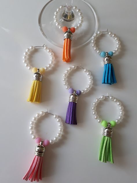 Bright Coloured Leather Tassel Wine Glass Charm Set with Pearl Beads  https://www.facebook.com/uniquewineglasscharms/ Stemless Wine Glass Charms Diy, Beaded Wine Charms, Wine Glass Charms Diy, Wine Charms Diy, Wine Bottle Charms, Wine Markers, Wine Glass Markers, Wine Glass Charm, Wine Glass Crafts