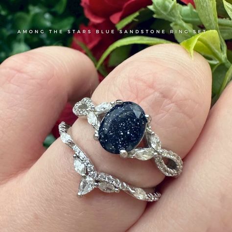 A nature inspired ring set that holds the starry night sky and looks like it would be straight out of ACOTAR 🌌 Among the Stars is a 925 sterling silver ring set holding a blue sandstone. A unique ring set filled with stars and magic ✨ #bluesandstonering #bluesandstone #bluegoldstone #acotar #nightcourt #velaris #rhysandfeyre #gemstonejewelry #crystalrings #alternativeengagementrings #uniquerings #crystalringset #promisering #starrynight #princessring #fantasyjewelry #fairytalejewelry Fairytale Engagement Rings, Blue Sand Stone, Fairy Tale Jewelry, Blue Sandstone, Nature Inspired Rings, The Starry Night, Princess Ring, Sterling Silver Rings Set, Silver Ring Set