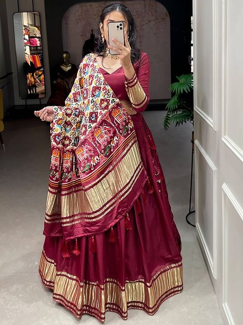 Get ready to turn heads and make a statement with our Spectacular Maroon Gaji Silk Lehenga Choli With Printed Dupatta. Ideal for weddings, mehendi functions, and ceremonies, this exquisite attire is sure to be the talk of the town. Crafted from premium quality gaji silk material, this maroon lehenga is designed with dyeing lagdi patti and features a cancan attached and micro cotton inner material, adding volume and movement to your every step. The lehenga has a 3.40-meter flair and is 41 inches Patola Dupatta Salwar Suits, Patola Dupatta With Lehenga, Lagdi Patta Dupatta, Gaji Silk Dupatta, Patola Lehenga, Marron Color, Silk Blouse Work, Tassels Dupatta, Rajasthani Lehenga