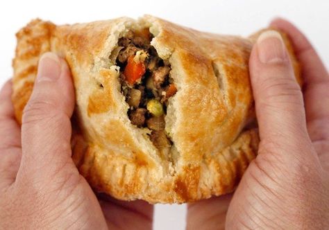 CURRIED MEAT PIES 4 T oil, divided 1 onion, diced 4 t curry powder 2 t ground cumin 1 t ground coriander 1 T minced garlic 2 T freshly grated ginger 1 lb ground lamb 1 t salt 1 t pepper 1/3 cup dry white wine 1 large boiling potato, ¼" dice 1 carrot, ¼" dice 1/2 cup beef or vegetable broth 1/2 cup peas 1/3 cup cilantro prepared pie dough Curried Lamb, Curry Lamb, Lamb Pie, Puff Pastry Crust, Seasoning And Spice, Hand Pie, Ground Lamb, Flaky Crust, Meat Pie