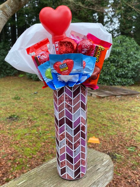 An assortment of candy arranged in a bouquet within a 20oz Tumbler! Tumbler Bouquet Diy, Tumbler Bouquet, Valentines Snow Globe Tumbler, Valentines Epoxy Tumblers, Valentine’s Day Tumbler Ideas, Candy Bar Bouquet, Valentine Bouquet, Event Gifts, Glitter Cups