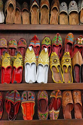 Mojari Traditional North Indian leather shoes, plain or variously decorated with embroidery and beads, for sale at a refreshment stop bet... #shoes #rajasthani Rajasthani Design, Embroidery And Beads, Traditional Shoes, Footwear For Men, Pink City, Beads For Sale, Agra, Elegant Woman, Design Inspo