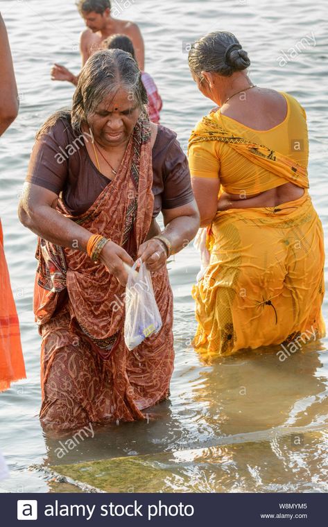 Download this stock image: An Indian Hindu woman wearing a sari performs an early morning bathing ritual in the River Ganges in Varanasi, Uttar Pradesh, India, South Asia - W8MYM5 from Alamy's library of millions of high resolution stock photos, illustrations and vectors. Ganga River, Bath Girls, Women Bathing, Beautiful Women Over 40, Indian Actress Hot Pics, Uttar Pradesh, Varanasi, South Asia, Beautiful Smile Women