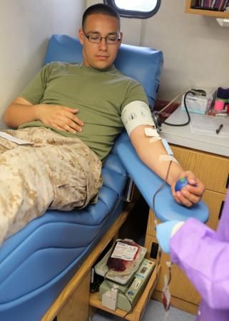 Cpl. Manuel Cedillo, supply specialist, 2nd Assault Amphibian Battalion, 2nd Marine Division, waits patiently while he donates blood aboard Marine Corps Base Camp Lejeune, June 13. The battalion’s medical staff contacted the Naval Hospital Camp Lejeune’s Blood Donor Center and hosted an Armed Services Blood Program blood drive to help with the increasing demand for blood donations in the military. (Photo by Cpl. Andrew Johnston, 2nd Marine Division) Marine Son, Army Medic, Army Couple Pictures, Fake Ft Call, Camp Lejeune, Army Nurse, Army Couple, Blood Drive, Medical Photos