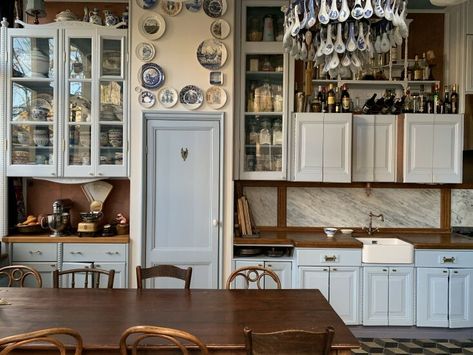 Dutch Light: A Collector's Vintage-Filled Home in a Former Tavern in Amsterdam - Remodelista Above Cabinet Decor, Above Cabinets, Double Glass Doors, Wooden Counter, Emily Henderson, Design Rules, Corner House, Stunning Kitchens, Dining Nook