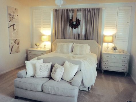 Military Spouse House: Peaceful Grey and Cream Master - ugly small windows above bed disguised by antique shutters and a connecting panel of drapes. Small Window Above Bed Ideas, Bedroom With Small Windows Above Bed, Small Windows Above Bed, Window Above Bed Ideas, Beds In Front Of Windows Ideas, Bed Under Window Ideas, Bed In Front Of Window Ideas, Windows Above Bed, Curtains Above Bed