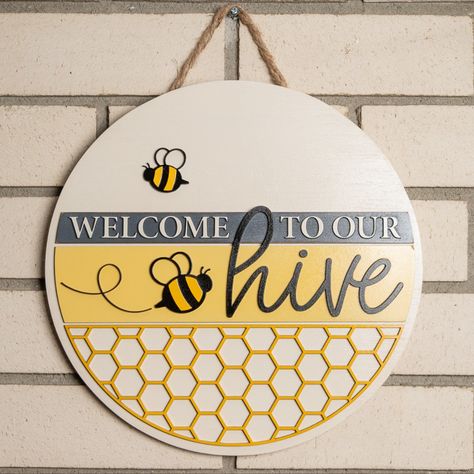 This cute welcome sign is perfect for summer! The adorable bees and hive design are laser-cut on a high grade plywood backing. This sign is hung with jute cord twine string. It's protected with a wood sealer and clear coat spray to keep the wood and paint looking great. Bee Hive Sign, Bumble Bee Welcome Sign, Bee Welcome Sign Front Door, Bumble Bee Wood Signs, Welcome To Our Hive Door Hanger, Patriotic Welcome Sign, Summer Porch Signs, Tooth Fairy Box, Bee Sign