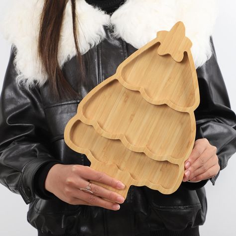 PRICES MAY VARY. CHRISTMAS TREE SHAPED: what you will receive are 1 pieces of christmas tree shaped bamboo serving platter, funny and cute,and it can meet your home and party decorating needs. HIGH QUALITY MATERIAL: Made of 100% Bamboo, elegant and durable. Well-sanded smooth surface, no splinters, burr and sharp corners. MULTI SCENARIO USAGE: It can be used as a children's plate in daily life, or as a snack tray during holidays, which is so exquisite and beautiful. SAFE AND NON-TOXIC: As a food