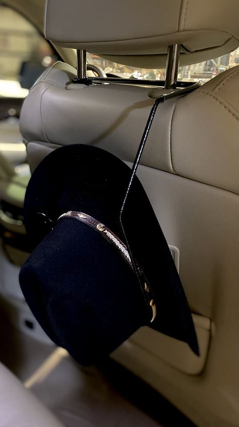 PRICES MAY VARY. Need a place to hang your hat while driving. We have just what you need. Slips around the headrest and cradles your hat perfectly. Easy to get to and keeps your hats at arms reach. American Made Powder coated Black Fits most modern trucks & SUVs with an adjustable headrest. A perfect gift for that cowboy or cowgirl in your life. Approximate size 13.5" H x 6" D x 9' W Please note: Remove when a passenger is seated in the seat facing hat holder ****Please note this item is Powder Cowboy Hat Holder, Cowboy Hat Rack, Western Car, Car Hat, Hat Day, Hat Holder, Hat Organization, Different Hats, Country Gifts