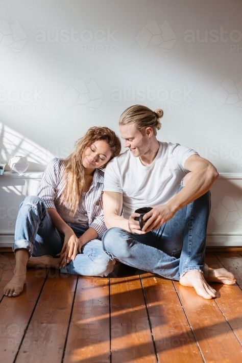 Young couple sitting on the floor relaxing at home : Austockphoto Sitting Pose Reference Couple, Two People Sitting On The Floor, Sitting Floor Pose Reference, Floor Sitting Reference, Couple Sitting Together Pose Reference, Couple Sitting Reference, Leaning On Each Other Pose, Couple Sitting Together Drawing, Boyfriend In Bedroom