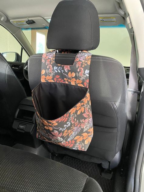 These bags are super useful for just about anyone! Hang it over the headrest in your car for a trash bag or kids toys, or hang it in the house on a door knob or over the stair rail for extra storage and organization.  The lining is waterproof too! So if it gets dirty you can just wipe it clean!  Velcro on the straps allow it to easily attach around headrests without a fight. Check out other car trash cans in my shop here: https://www.etsy.com/shop/PellieBrandDesigns?section_id=33596091 Back Seat Car Decor, Camping Inspo, Hippie Car, Mom Best Friend, Car Trash Can, Stair Rail, Girly Car Accessories, Car Trash Bag, Best Friend Birthday Gift