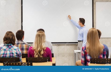 Education, high school, teamwork and people concept - smiling teacher standing in front of students and writing something on white board in classroom Classroom Photo, World Teachers, Photo Grouping, Happy Teachers Day, Single Person, Teacher Classroom, School Students, White Board, Teamwork