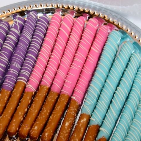 Our beautiful chocolate pretzel rod platters are a great addition to any candy bar or dessert table.  www.enjouchocolat.com #candybar Colorful Pretzel Rods, Mermaid Chocolate Covered Treats, Encanto Pretzel Rods, Mermaid Party Treats Dessert Tables, Mermaid Pretzel Rods, Ursula Party, Fall Snack Mixes, Mermaid Baby Shower Theme, Mermaid Food