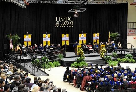 @University of Maryland Baltimore graduation Graduation Setup Ideas, Graduation Stage Flower Arrangements, Graduation Ceremony Decorations Stage, Graduation Stage Design, Graduation Ceremony Decorations, Stage Flowers, Graduations Ideas, Conference Decor, Graduation Stage