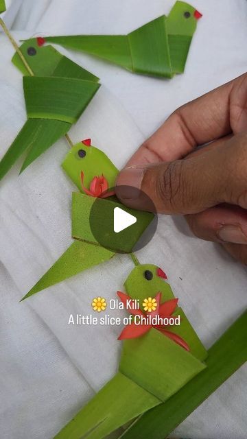 Handcrafted by മനുഷ്യന്‍ 🤗🌺 on Instagram: "Ola kili—those simple coconut leaf parrots we all made as kids. Nostalgic, familiar, yet always special. ☺️🦜❤️
Over the years, I’ve been fortunate to learn intricate patterns using coconut leaves directly from elders, but this simple Ola Kili has always held a special place in my heart☺️
Try it and let’s relive a bit of our childhood together🤍
.
.
.
.
.
.
.
.
.
.
.
.
.
.
.
.
.
.
.
#visualart #malayalam #kerala #keralareels #love #coconutleafcraft #coconutleafdecor #leafdecor #coconutleafparrot #parrot #traditional #nature #floral #floraldesign #floralarrangement #festive" Diwali Art And Craft, Puja Decoration Ideas, Leaf Activities For Kids, Kids Nature Activities, Parrot Craft, Eco Craft, Flower Garland Diy, Coconut Decoration, Origami Leaves