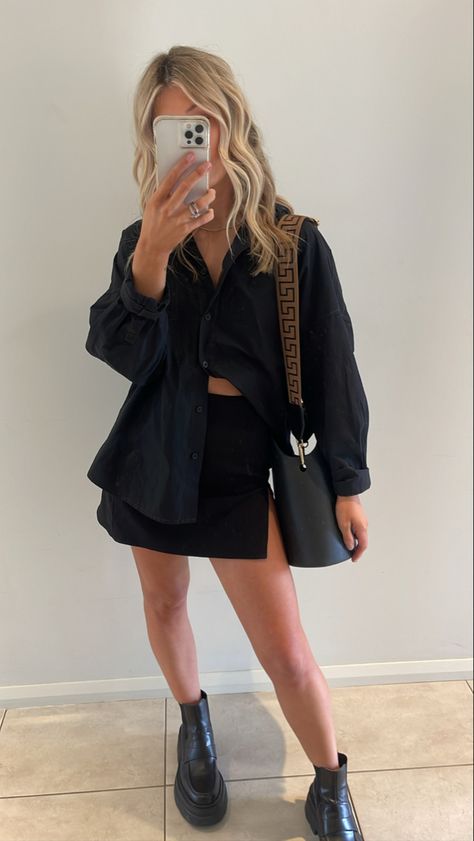 Black mini skirt and overshirt A classic black mini skirt with a button up black shirt Paired back with ALIAS MAE boots and Nim the label bag #chicstyle #miniskirtoutfit #skirtfashion #skirtoutfit #fashion #classic #aliasmae #bootsforwomen #boots #chunkyshoes #skirts #OOTD #ootdfashion #fashionandstyle Black Mini Skirt Street Style, Mini Skirt Outfit Going Out, Black Silk Mini Skirt Outfit, Night Out Skirt Outfit, Button Down And Skirt Outfit, Button Up With Skirt Outfit, Mini Skirt Outfit Summer Night, Black Mini Skirt Outfit Night Classy, Black Skirt Outfit Spring