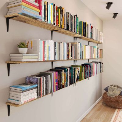 Bring rustic charm and ample storage to your living room with our 60"x8" floating bookshelves. Crafted from high-quality wood and finished in a stunning burnt style, these shelves are perfect for wall-mounted book shelves and storage shelves. Transform your walls into a striking display of your favorite books and decor, and revel in the beauty of a well-organized, stylish home. Size: 5.6" H x 60" W x 6" D | Ebern Designs 60"x8" Floating Bookshelves for Wall, Book Shelves for Living Room, Storage Full Wall Shelves, Bookshelves Living Room, Bookshelf Designs, Shelves Bedroom, Hanging Bookshelves, Long Floating Shelves, Creative Bookshelves, Floating Bookshelf, Bookshelves In Bedroom