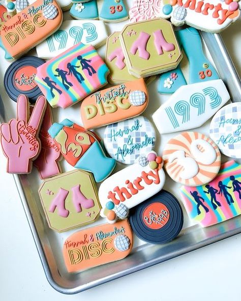 Morgan McShan on Instagram: "Pick a favorite…. I think mine is the Disco ball cookies… printed with Eddie from a clip art from Canva 🪩💃🏼🕺 • • • • #discocookies #groovycookies #groovybirthday #discobirthdayparty #houstontreats #houstonsmallbusiness#texascookier #houstoncookier #royalicingcookies #decoratedsugarcookies #cookiedecorating #houstoncookies #houstonsugarcookies #houstonbusiness #houstonbaker #houstoneats #houstonblogger #girlboss" 70s Themed Birthday Cookies, 70s Theme Cookies Decorated, Disco Party Cookies Decorated, Disco Cookies 70s, 70s Cookies Decorated, Abba Cookies, Disco Birthday Cookies, Disco Themed Cookies, Disco Ball Sugar Cookies