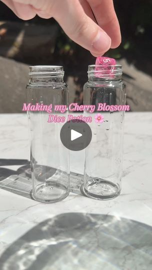 2.3M views · 35K reactions | Making my Cherry Blossom dice potion!  #potion #potions #potionbottle #fantasy #bookshelfdecor #art #decor #dice #dnd5e #dndart #dnd #fantasyart #dicegoblin | Forbidden Forest Apothecary | Forbidden Forest Apothecary · Original audio Dnd Dice Potion Bottle, D&d Potion, Diy Potion Bottles Liquid, Forest Apothecary, Glitter Bottles, Craft Booth Design, Diy Dice, Dice Roller, Forbidden Forest