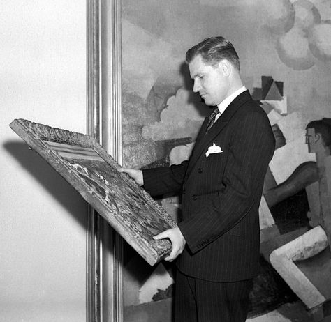 Nelson #Rockefeller examines a #painting at New York's #Museum of #Modern #Art in 1939. Rockefeller was 23 when he hired #Diego #Rivera to paint a mural in the newly built Rockefeller Center. Tate London, American Propaganda, Nelson Rockefeller, Barnett Newman, Primitive Art, Tate Gallery, New York Museums, Diego Rivera, Rockefeller Center