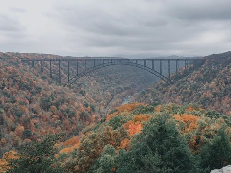 New River Gorge Bridge never looked more stunning than from Long Point Trail during peak fall colors. This is West Virginia at its best! 🌄🍁 #newrivergorgenationalpark #longpointtrail #nationalpark #fallinlovewithfall #westvirginia #fallmagic🍁 #fallcolors #naturegirl #newrivergorge #newrivergorgebridge #hiking Virginia Aesthetic, New River Gorge Bridge, Green Bank, New River Gorge, New River, Nature Girl, West Virginia, Fall Colors, Virginia