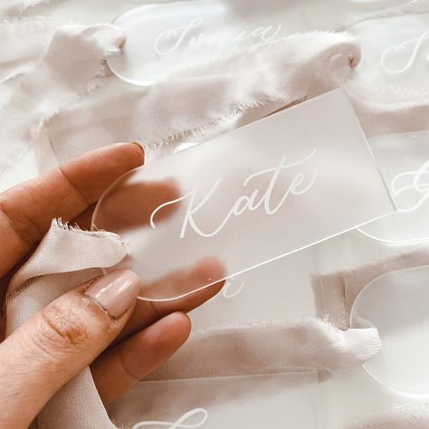 These bridal luggage tags are great to complement your bridesmaid gift bags, hangers or doors. The frosted arch acrylic along with the softest silk adds a touch of romance to these personalised tags and will be the perfect addition to your bridal shower or party.  Additional Information: Acrylic Tag Size: 9.5cm x 4.5cm Acrylic Colour: Frosted Acrylic Thickness: 3mm Ribbon Size: 25cm  Ink Colour: White HOW TO ORDER:  1) Please select your quantity by selecting the amount.  2) Please select the si Name Tags At Wedding Place Settings, Hanger Tags Wedding, Acrylic Name Tags Wedding, Wedding Luggage Tags, Name Tag Wedding, Acrylic Name Tags, Name Tags Wedding, Diy Name Tags, Wedding Luggage