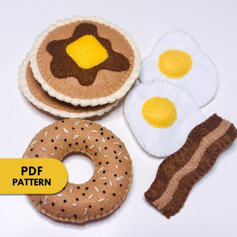 This is a PDF document that includes: A List of Materials Written Step by Step instructions Shape Templates You will learn to create Felt Breakfast Foods. Upon purchase, you will receive an instant download that can be accessed on your Desktop Computer under Purchases on the Etsy Website. Whether you are just learning or an avid sewer, this is a fun project to do year-round! Visit my TikTok page for Video Tutorial Examples https://www.tiktok.com/@annelourayne?is_from_webapp=1&sender_device=pc This tutorial is for personal use only. You may not sell products made from this pattern. Re-sale or distribution of patterns and tutorial , in any form, is strictly prohibited. Fabric Food Patterns, Felt Egg Pattern, Felt Breakfast Food, Felt Food Patterns Free Templates, Free Felt Patterns, Felt Food Templates, Felt Bread, Felt Pie, Felt Food Patterns Free