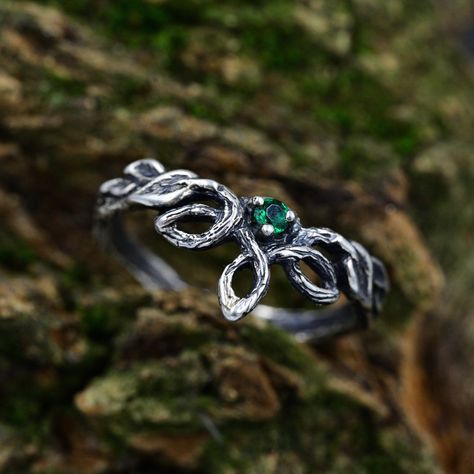 Handcrafted from sterling silver, our Emerald Elven Branch Wedding Ring for women is an enchanting and unique piece that embraces the magic of nature. With intricate details of a branch, vine, and delicate emerald, this fantasy engagement ring captures the essence of an enchanted forest. The silver leaf design adds a touch of elegance to this nature-inspired ring, making it a unique and timeless jewelry piece. Ideal for those seeking an elven aesthetic or a woodland gift. Characteristics: Metal - Recycled solid sterling silver  Stone - Cubic Zirconia Finish - Oxidized. View all silver elven rings: https://www.etsy.com/shop/TinyShinyJewel?ref=seller-platform-mcnav&section_id=47130640 Care instructions: To care for the ring, avoid contact with water and chemicals such as perfumes and lotions Emerald Jewelry Silver, Fantasy Inspired Rings, Enchanted Forest Wedding Rings, Enchanted Forest Ring, Fantasy Rings Aesthetic, Elven Ring Engagement, Forest Engagement Ring, Elven Engagement Ring, Nature Inspired Wedding Rings