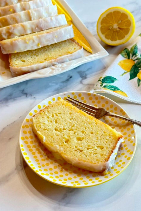 A slice of lemon loaf cake with lemon glaze on a yellow plate. Starbucks Iced Lemon Loaf, Iced Lemon Loaf, Delicious Lemon Cake, Lemon Loaf Recipe, Starbucks Lemon Loaf, Starbucks Lemon, Moist Lemon Cake, Lemon Loaf Cake, Lemon Icing