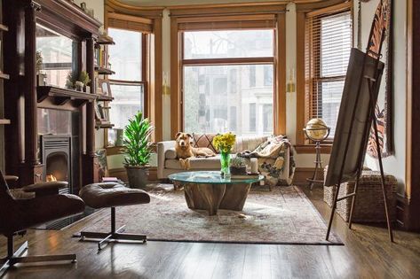 Architectural Millwork in a Chicago Greystone Apartment | Apartment Therapy Apartment In Chicago, Cup Of Jo, Nursing Chair, Cost Plus World Market, Wood Molding, Living In New York, Fireplace Mantle, Cozy Apartment, Wooden Bar