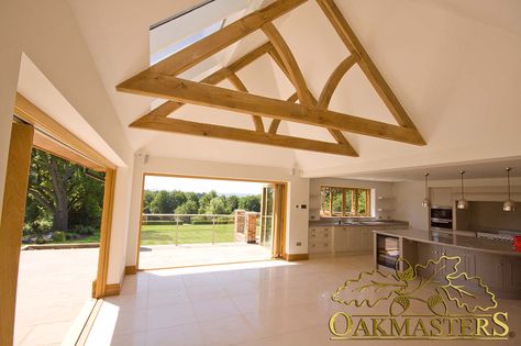 Simple and stylish oak trusses will be an eye-catcher in any room. Beams Bedroom, Interior Beams, Oak Extension, Wooden Extension, Vaulted Ceiling Decor, Timber Frame Extension, Wood Extension, Oak Framed Extensions, Kitchen Conservatory