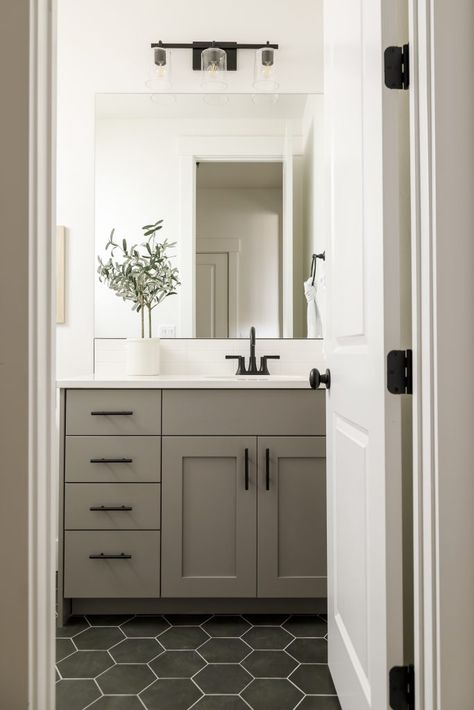 The Juniper in Arbor Grey Paint House Interior, Grey Cabinets Master Bath, Gray Painted Bathroom Cabinets, Dark Neutral Bathroom Ideas, Guest Bathroom Painted Cabinets, Sherwin Williams Dovetail Gray Cabinets, Guest Bathroom Transitional, Cabinet Paint Colors Bathroom, Small Bathroom Grey Vanity