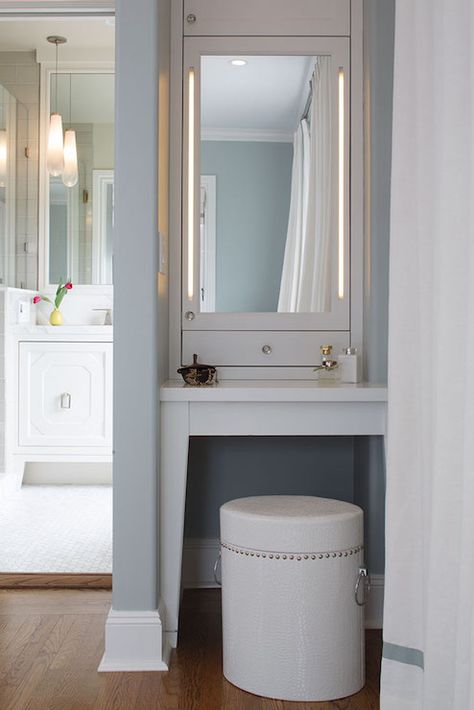 Chic dressing room features blue painted alcove filled with a built-in make up vanity paired with ... Closet With Vanity, Built In Makeup Vanity, Chic Dressing Room, Makeup Room Design, Vanity Nook, Vanity Redo, Dressing Chic, Built In Vanity, Bathroom Vanity Storage