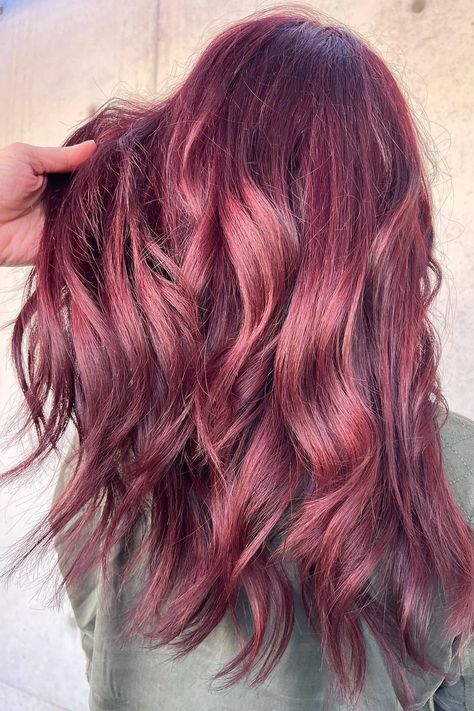 Woman with a light red balayage on her brown hair. Strawberry Wine Hair Color, Light Red Balayage, Mauve Brown Hair, Red Balayage On Brown Hair, Mahogany Brown Hair Color, Balayage On Brown Hair, Mahogany Hair Color, Rose Hair Color, Mahogany Brown Hair