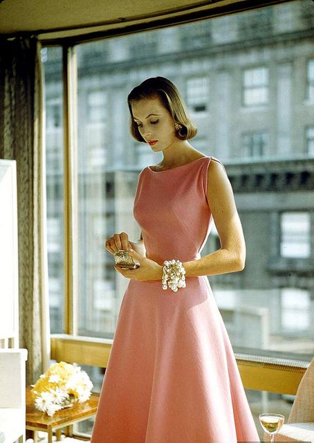 Model is wearing party dress of pink wool jersey by Pauline Trigère with wrapped ropes of dripping pearls by Mosell, photo by Nina Leen, 1954 1954 Fashion Women, Mid Century Modern Fashion Woman, 1950s Party Dress, Classy Pink Dress, Pink Vintage Dress, Nina Leen, Pauline Trigere, 1950 Dress, Party Dress Pink