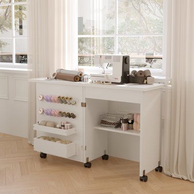 Looking for a sewing table? This is the perfect one for you. The foldable design not only saves space but also has multi-purpose use. It can be a sewing table, a craft table, or a side table, and is perfect for home use. There are 2 hidden bins and 1 shelf attached for storage purposes, you can put your sewing tools. This sewing table is finished white and is made of high-quality MDF board, you don’t need to worry about it being damaged when expanding it due there is a lock that keeps the stabil Sewing Machine Desk, Sewing Tables, Table With Wheels, Sewing Desk, Aging Humor, Sewing Station, Sewing Machine Table, Coin Couture, Sewing Cabinet