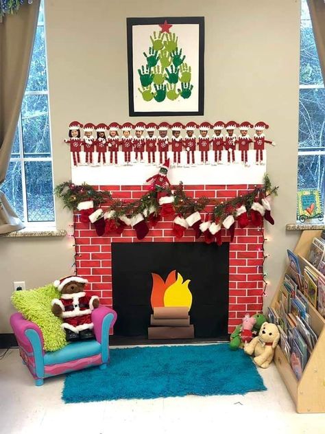 Classroom Fireplace Diy, Fireplace Preschool Classroom, Christmas Daycare Room Ideas, Christmas Dramatic Play Toddlers, Classroom Fireplace Ideas, Preschool Christmas Room Decor, Paper Fireplace For Classroom, Christmas Dramatic Play Preschool, Classroom Fireplace