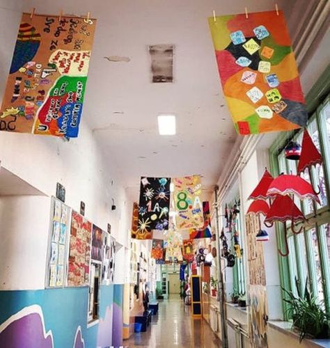 25 Wonderful Ways To Make School Hallways Positive and Inspiring Kindness Hallway Display, Hanging Art In School Hallway, Painting School Walls, Displaying Art In School Hallway, High School Hallway Ideas, School Staircase Decorations, Welcome Back To School Hallway Decor, Art Work Display Preschool, School Hallway Themes Ideas